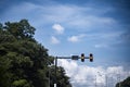 Traffic lights on the bright blue sky background Royalty Free Stock Photo