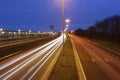 Traffic lights at night on highway Royalty Free Stock Photo