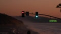 Traffic lights, pacific coast highway, California. Road trip along ocean in dusk Royalty Free Stock Photo