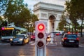 Traffic lights in Paris with Arc de Triomphe in background