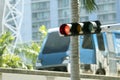 Traffic lights regulating driving cars on city street in Miami, Florida Royalty Free Stock Photo