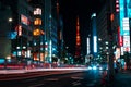 Traffic lights and road to Tokyo Tower at night, city life of Japan