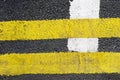 Traffic lines on the asphalt road surface is composed of one type of background. Royalty Free Stock Photo