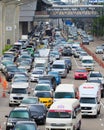 Traffic moves slowly along a busy road. Royalty Free Stock Photo