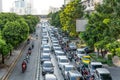 Traffic moves slowly along a busy road cowded traffic jam road in city. Empty fast speed dedicated bus lane Bangkok Royalty Free Stock Photo
