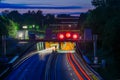 Traffic at night. Lights of the cars on the highway at the entrance to the tunnel. Highway road tunnel at night. Royalty Free Stock Photo