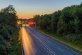 Traffic at night. Lights of the cars on the highway at the entrance to the tunnel. Highway road tunnel at night. Royalty Free Stock Photo