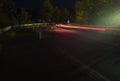 Traffic at Night - Red and White Light Trails around a Highway Corner Royalty Free Stock Photo