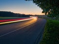 Traffic on non urban street with lighttrails Royalty Free Stock Photo