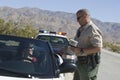 Traffic Officer Checking Woman's License Royalty Free Stock Photo