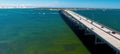 Traffic over Rickenbacker Causeway on a sunny day, aerial view from drone in slow motion