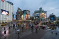 Traffic and people walking on crosswalk with falling rain at Ximending in Taipei, Taiwan. Ximending is the famous fashion, night