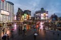 Traffic and people walking on crosswalk at Ximending with falling rain in Taipei, Taiwan. Ximending is the famous fashion, night