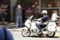 Traffic police officer riding motorbike in the city street