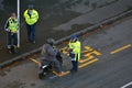 Traffic Police officer writing a traffic citation to a scooter r