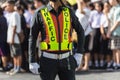 Traffic police standing on the road while doing the work