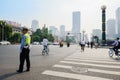 Traffic policeman at intersection in sunny city morning