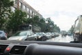 Traffic in rainy day with road view through car window with rain drops, blurry traffic on rainy day. Bucharest, Romania, 2020 Royalty Free Stock Photo