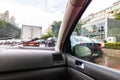 Traffic in rainy day with road view through car window with rain drops, blurry traffic on rainy day. Bucharest, Romania, 2020 Royalty Free Stock Photo