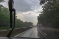 Traffic in rainy day with road view through car window with rain drops, blurry traffic on rainy day. Bucharest, Romania, 2020 Royalty Free Stock Photo