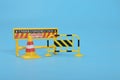 Traffic road barrier: A warning barrier for road closure and website under construction page. Includes warning and stop signs, Royalty Free Stock Photo