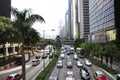 Traffic road with Chinese people drive and ride on harbour road in Hong Kong, China