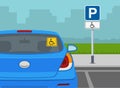 Traffic or road rules. Disabled parking area sign. Back view of a blue sedan car with handicap access sticker on rear window. Royalty Free Stock Photo