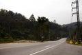 Traffic road and thai people and foreign travelers driving journey on highway street in forest mountain at Pai city hill valley on