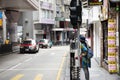 Traffic road and Travelers thai woman waiting crossing road at Hollywood Road in Hong Kong, China