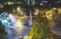 Traffic on roundabout street in city of Vranje at night