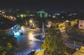 Traffic on roundabout street in city of Vranje at night