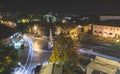 Traffic on roundabout street in city of Vranje at night