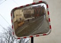 Traffic safety mirror with reflection of  old street, Krakow, Poland Royalty Free Stock Photo