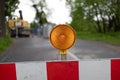 Traffic safety and warning light - roadblock with orange light.