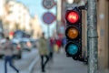 Traffic semaphore with red light against the backdro of the city traffic