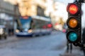 Traffic semaphore with red light against the backdro of the city traffic