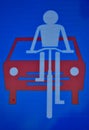Traffic sign, biker and red car Royalty Free Stock Photo
