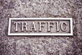 A `Traffic` sign embossed in brass - concept image