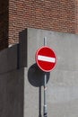 Traffic sign Entrance prohibited against the background of a concrete wall