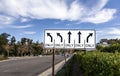 Traffic Sign with five arrows for different directions against a blue sky Royalty Free Stock Photo