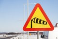 A traffic sign that means warning for strong winds Royalty Free Stock Photo
