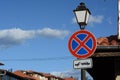 Traffic sign No Stopping on streetlight against blue sky Royalty Free Stock Photo