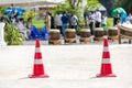 Traffic sign. Orange cone with white stripes at road background. Parking lot with traffic cone on street used warning sign on road Royalty Free Stock Photo