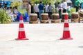 Traffic sign. Orange cone with white stripes at road background. Parking lot with traffic cone on street used warning sign on road Royalty Free Stock Photo