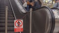 Traffic sign prohibited pedestrians on escalator. Stopping one section escalator Royalty Free Stock Photo