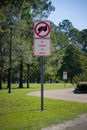 Traffic sign prohibiting the parking on the grass in the park. Nature. Road sign in the rest area. Rules for travelers Royalty Free Stock Photo