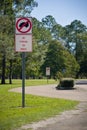 Traffic sign prohibiting the parking on the grass in the park. Nature. Road sign in the rest area. Rules for travelers Royalty Free Stock Photo
