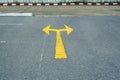 A traffic sign on the road a yellow arrow on the road, traffic concept Royalty Free Stock Photo