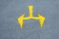 A traffic sign on the road, yellow arrows on the asphalt in the car park Royalty Free Stock Photo