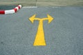 A traffic sign on the road, yellow arrows on the asphalt in the road Royalty Free Stock Photo